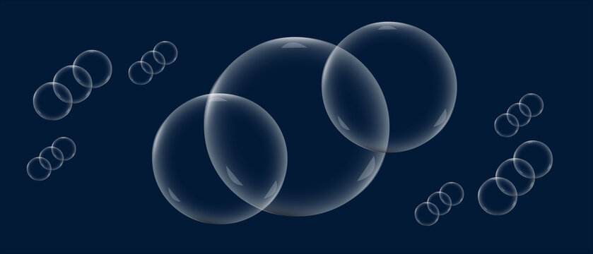 Transparent soap bubbles floating on a dark blue background