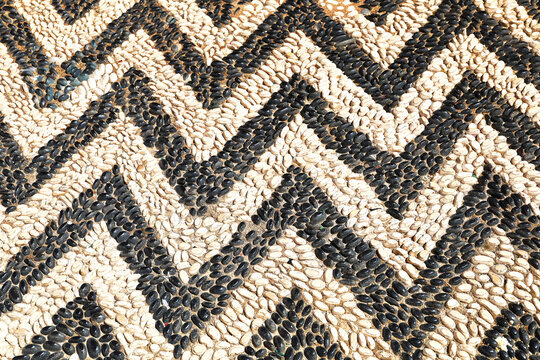 A path made of pebbles arranged in a pattern, Symi Island, Greece.