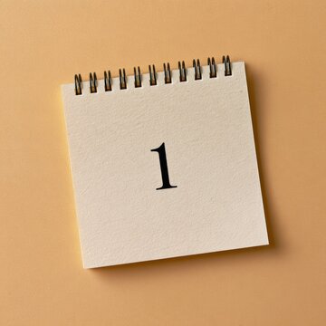 A simple calendar page displays the number 1 for the first week of the year, set against a warm cream background.