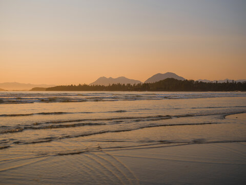 Ocean waves in Tofino, Vancouver island at sunset