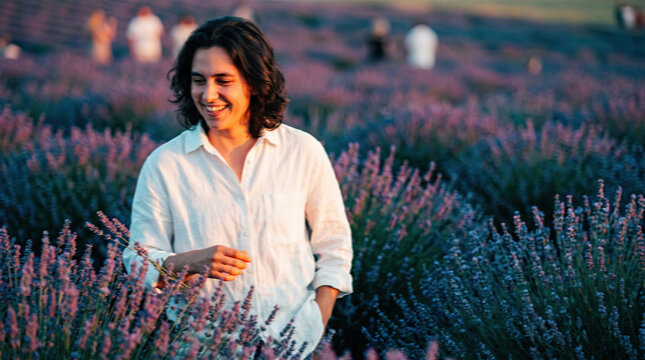 Man Walking Through Lavender Field During Golden Hour Sun