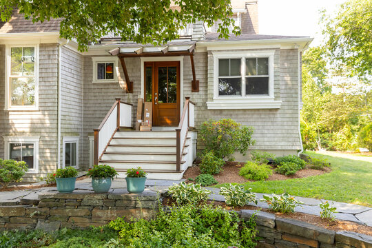 Online package order delivered to door stairway of home facade