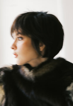 Woman Looking to the Side With Short Hair and Fur Coat
