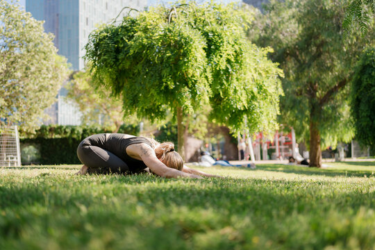 Woman Practicing Yoga in the Park During Her Morning Me Time