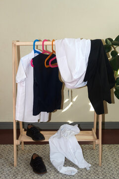 Disorder on the children's school clothing rack.