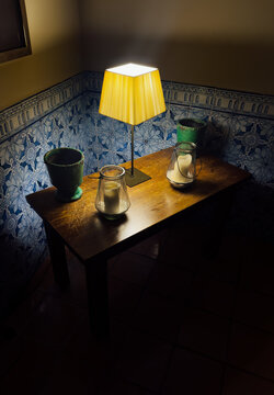 Warm table lamp illuminating a vintage interior still life