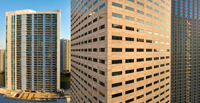 View from above of skyscraper buildings in downtown district of Miami, Florida, USA. American city with business financial district at sunset