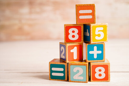 Number wood block cubes for learning Mathematic, education math concept. Colorful wooden blocks numbers