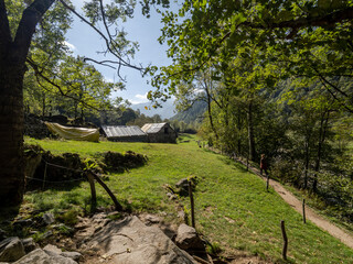 Hiker on Verzasca River trail (Sentiero Verzasca) from Sonogno to Lavertezzo, Switzerland © Catalin