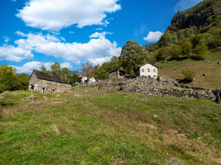 Old medieval houses along the Verzasca River trail (Sentiero Verzasca) from Sonogno to Lavertezzo, Switzerland © Catalin