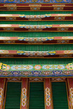 Ornate painted wooden ceiling of Hazrat Khizr mosque in Samarkand with intricate floral, geometric patterns. Vibrant detail of traditional Uzbek craftsmanship ideal for travel, cultural publication.