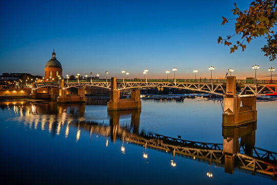 Toulouse, France - September 20, 2026: The illuminated Saint-Pierre Bridge and the Dome de la Grave in Toulouse at night