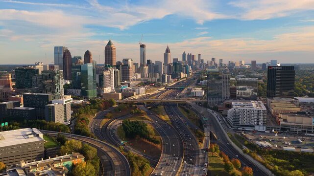 Atlanta, Georgia urban landscape with skyscraper buildings and highway interchange connecting interstate speedways. Road design and development concept.