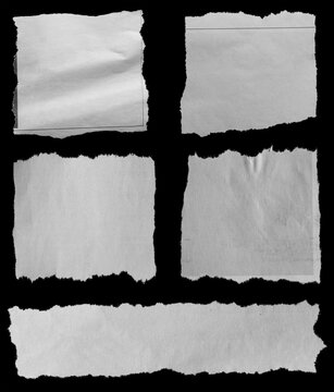 Torn papers on black