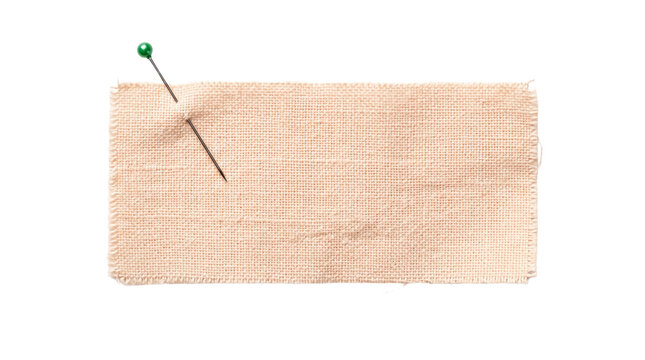 A vibrant green-headed sewing pin piercing a rectangular piece of textured beige fabric, isolated on a clean white background, symbolizing crafts, textile work, and creative projects