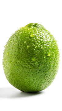 Fresh Lime on a Bright White Background with Dewy Water Droplets, Showcasing Its Vibrant Green Color and Textured Skin, Perfect for Culinary and Food Photography