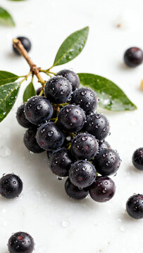 Acai Berry Cluster with Dew Drops on a Bright White Surface, Capturing the Essence of Freshness and Nutritional Power in a Vibrant Still Life Composition