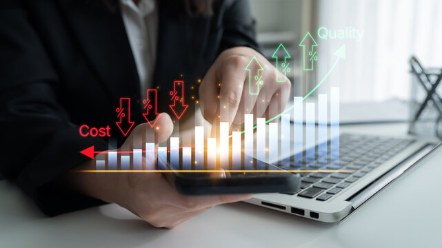 Business Professional Analyzing Data on Smartphone while Enhancing Quality and Reducing Cost with Financial Charts in Modern Office Environment. Bitwise.