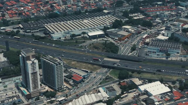 Aerial view of a highway warehouses and apartment towers in Sao Paulo