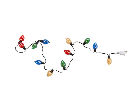 A string of colorful incandescent christmas light bulbs in red, green, blue, and yellow with a white electrical plug on a black background, isolated on a, transparent background