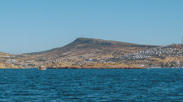 Fo&ccedil;a, Turkey - September 12, 2026: View of Old Fo&ccedil;a from the sea, showing coastal houses, traditional architecture, waterfront scenery, and the blue Aegean Sea.