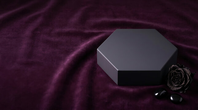A luxurious dark gray hexagonal box with a rose on a velvet background