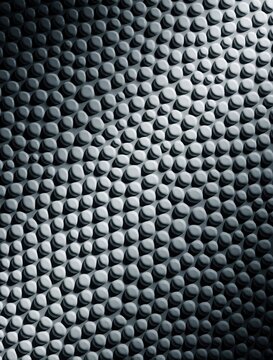 Abstract grey background with raised 3D dots pattern. Seamless textured surface shows repetitive bumps, shadows. Modern minimalist decor style suitable for wallpaper, textile design, digital