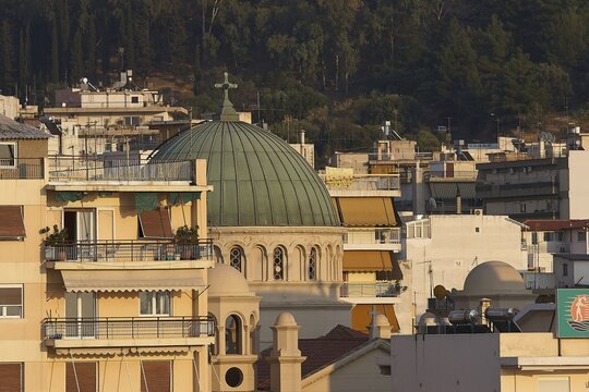 City view with domed buildings in the foreground and wooded hills in the background, Patras, Peloponnese, Greece