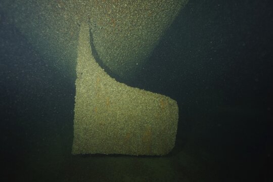 Large ship's rudder, with mussels, quagga triangular mussel (Dreissena rostriformis bugensis), invasive species, overgrown, lies in dark depths, dive site wreck of the Jura, Lake Constance, Bottighofen, Switzerland, M&uuml;nsterlingen, Germany