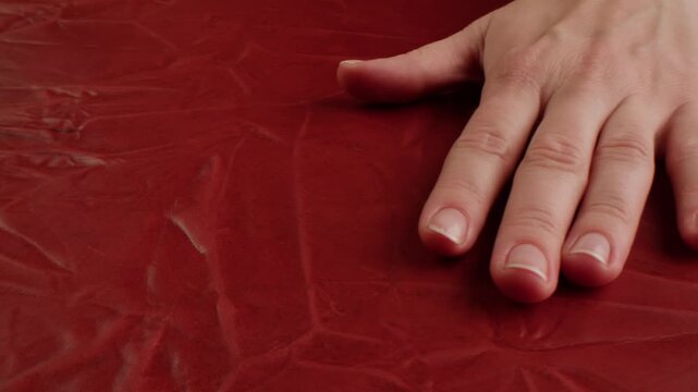 Genuine red leather texture, natural animal skin, luxury vintage cowhide background. Eco friendly leatherette, faux leather. Wallpapere, backdrop, copy space