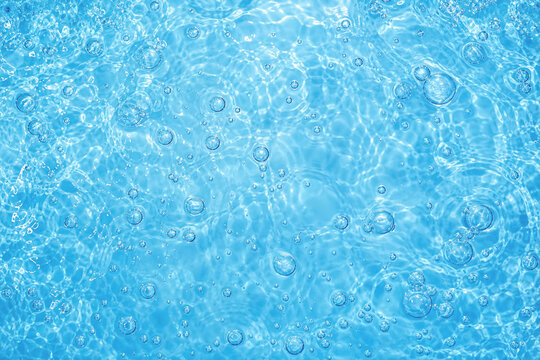 Blue clear fresh Water in jacuzzi. Spa massage background.