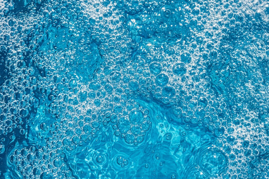 Blue clear fresh Water in jacuzzi. Spa massage background.