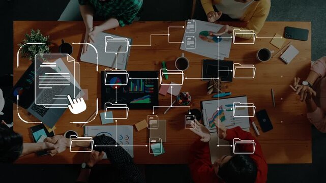 A diverse team gathers around a wooden table, collaborating on data analysis and document management in a modern office setting, showcasing teamwork and creativity. Raster
