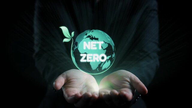 This striking image features hands holding a glowing globe symbolizing the net zero concept, emphasizing sustainability, climate action, and ecological balance in a modern world. Qubit