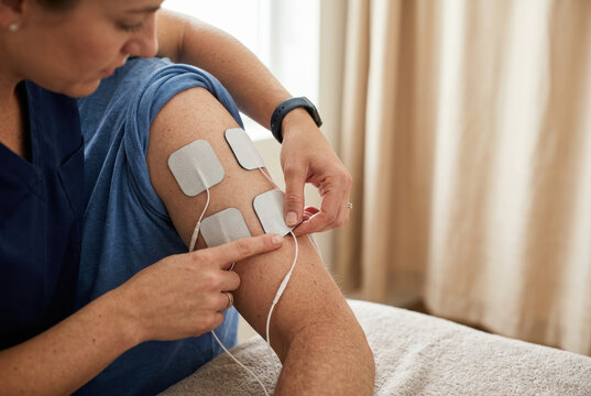 Physical therapy electrotherapy muscle stimulation rehabilitation leg electrode medical treatment pain relief recovery healthcare professional therapy session supports physical therapy