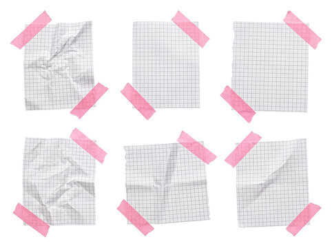 Collection of white grid paper pieces taped with pink adhesive tape