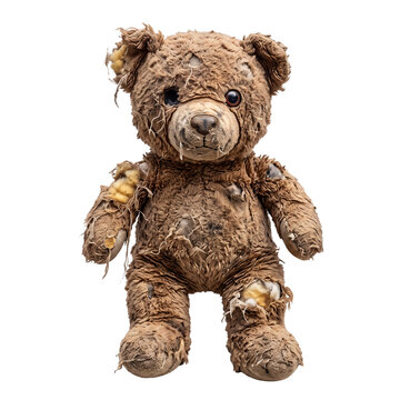 Old damaged teddy bear ripped with stuffing coming out