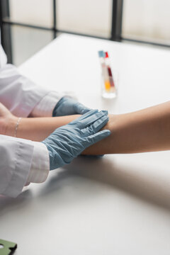 Doctor preparing to draw blood from the patient