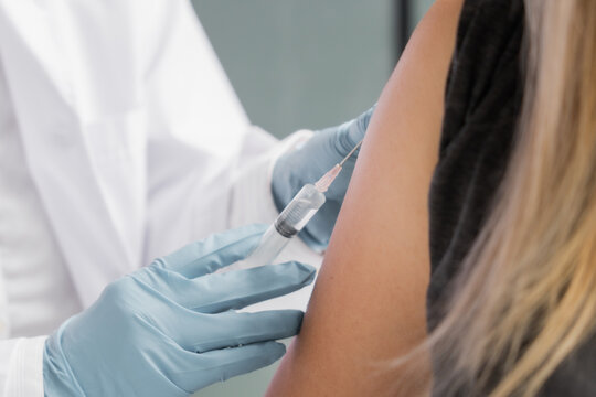 Mature Asian give the patient an injection