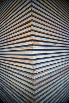Abstract Right Angle Corner Wall with White Pine Wooden Strakes.