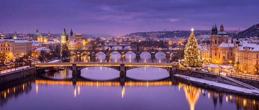 Prague skyline panoramic view with illuminated bridges across the river during winter twilight evening