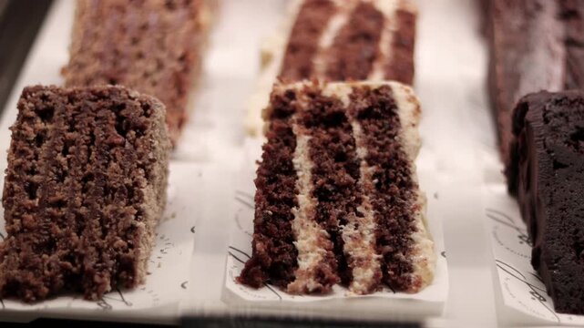 Pieces of cake displayed and beautifully decorated, ready to be enjoyed and shared with people on special occasions. Food, holidays, memories