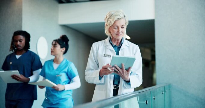 Medical, happy or doctor in hospital with tablet, progress update or optimistic for treatment plan. Laugh, mature woman or surgeon with tech, diagnosis success or positive feedback in health results.