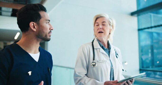 Medical, team and walk in hospital with tablet, mri report and donor registry of recipient surgery. People, talking and digital in lobby for case study, organ donation and collaboration for treatment