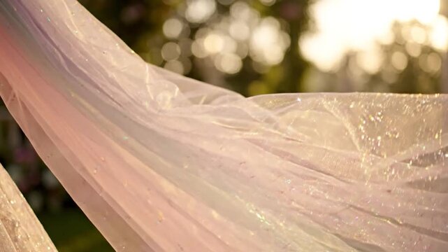 Close-up of flowing iridescent holographic fabric textures.