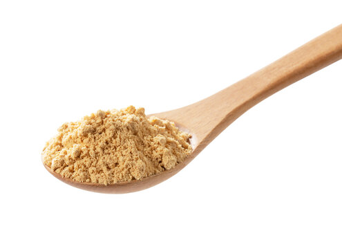 Roasted soy flour Kinako on a wooden spoon isolated on transparent background