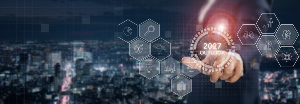 2027 Business Outlook. Future Trends, Strategic Planning and Growth Opportunities. Touching a glowing 2027 Outlook interface with futuristic icons. Business forecasting and market trends.