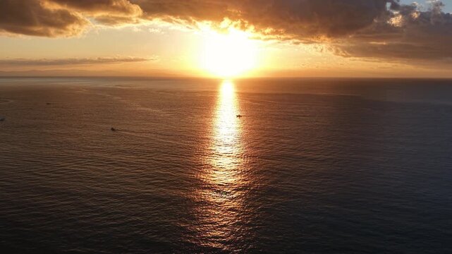 Aerial Shot of Sunrise over Calm Sea with Fishing Boats (Horizontal | Real Time | Right-to-Left Tracking Shot)