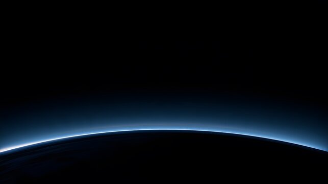 Curved horizon of planet earth with blue atmosphere in black space