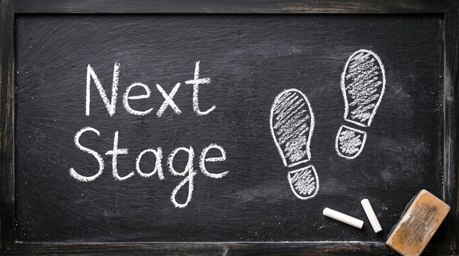 Next Stage chalkboard with footprints and chalk symbolizing progress and advancement